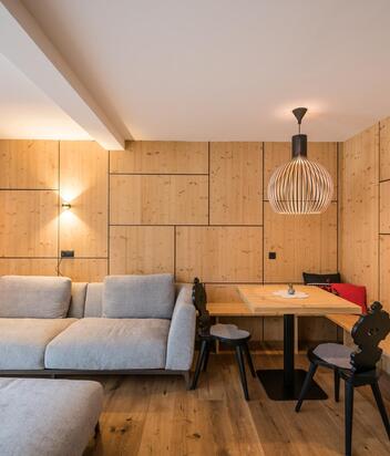 Sofa and living area of the "Caminetto Penthouse Suite"