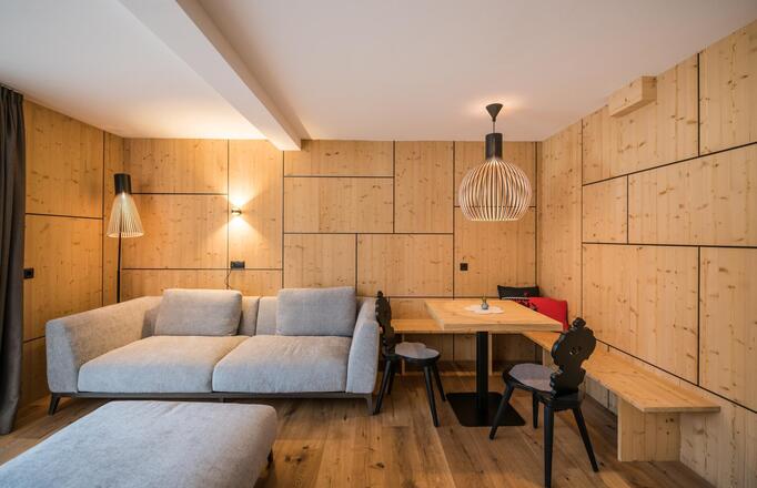 Sofa and living area of the "Caminetto Penthouse Suite"