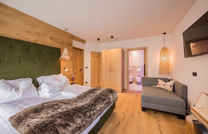 Dependance nature with bed, sofa, wardrobe, TV and bathroom