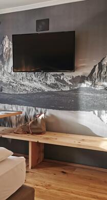 Dolomites Suite with TV, mini fridge and small table with bench